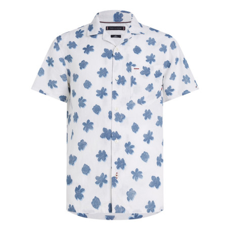 Chemise en lin blanche fleurie avec une coupe...