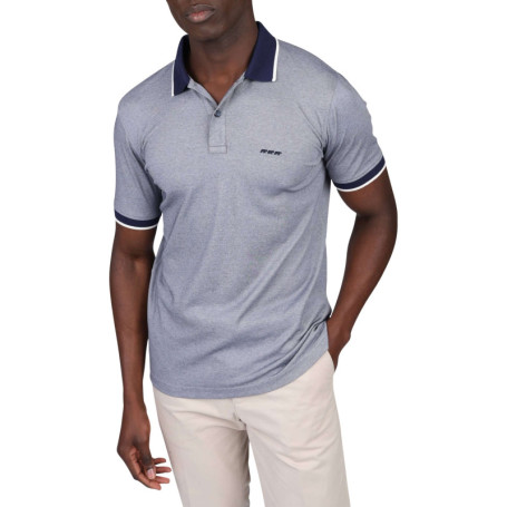Polo marine uni avec une coupe droite à col à...