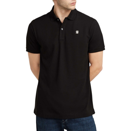 Polo en coton noir uni avec une coupe droite et...