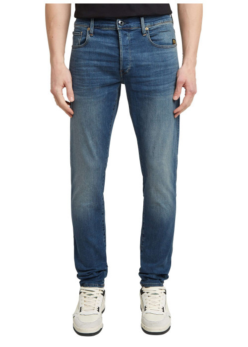 Jean en coton bleu avec une coupe slim et des passants pour ceinture