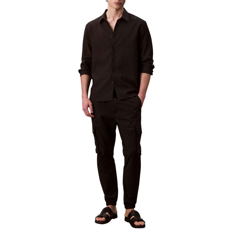 Calvin Klein Jeans - Pantalon Cargo Noir Uni à Coupe Slim Et à Ourlets élastiqués - Noir Calvin Klein Jeans - Pantalon Cargo Noir Uni à Coupe Slim Et à Ourlets élastiqués - Noir