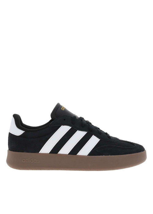 Tennis noires en croûte de cuir avec semelle à talon plat et à lacets