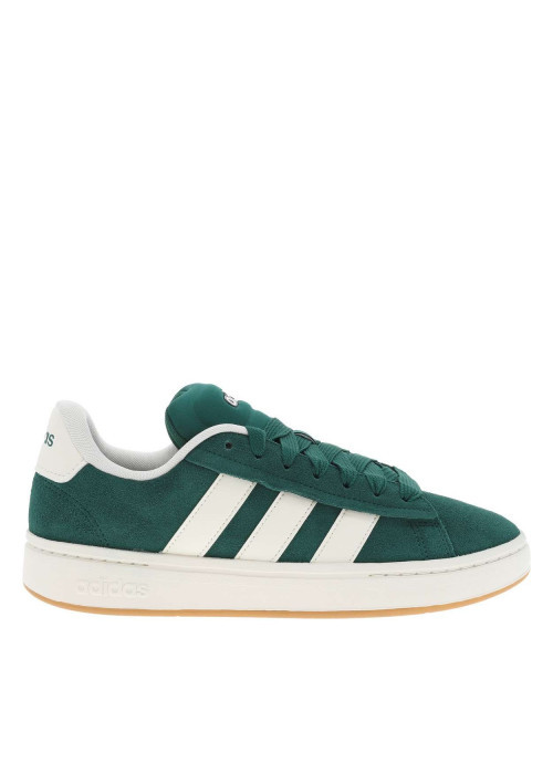 Tennis vertes et blanches à talon plat avec des lacets larges