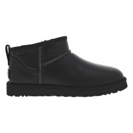 Boots en cuir noires à talon plat avec des...