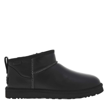 Boots en cuir noires à talon plat avec des...