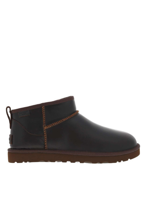 Boots en cuir marron à talon plat avec une doublure en fausse fourrure