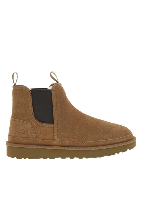 Boots en cuir camel à talon plat pourvues de soufflets élastiqués