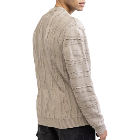 Pull en coton beige pourvu d'un col rond et de...