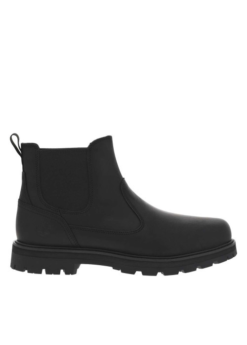 Boots en cuir noires avec un talon plat et des soufflets élastiqués