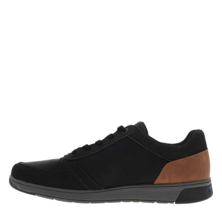Sneakers noires à talon plat avec des lacets et...
