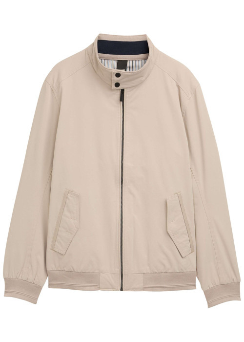 Blouson beige uni avec une coupe droite et deux poches raglan à l’avant