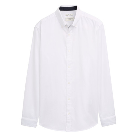 Chemise blanche uni avec un col boutonné et des...