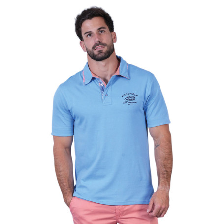 Polo en coton biologique bleu uni pourvu d'un...