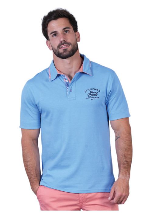 Polo en coton biologique bleu uni pourvu d'un col boutonné et d'une coupe droite