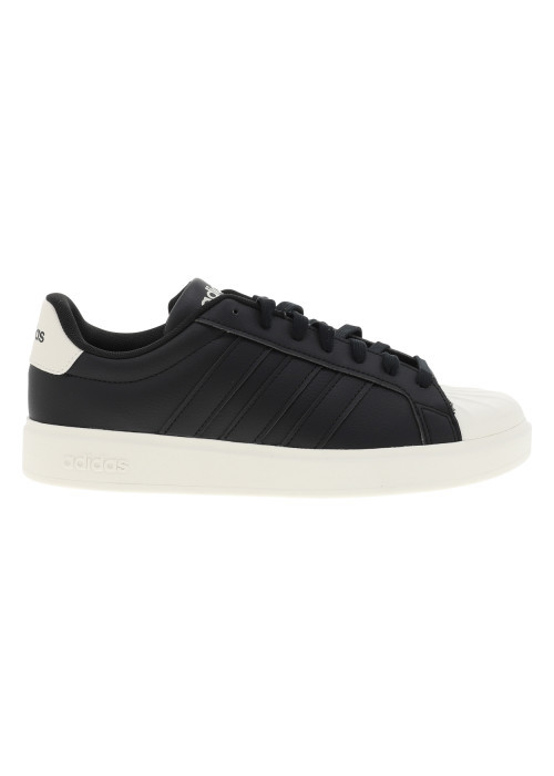 Baskets noires à talon plat avec des lacets et une semelle blanche