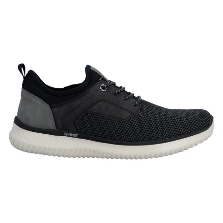 Sneakers noires à talon plat avec une languette...