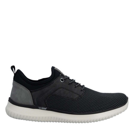Sneakers noires à talon plat avec une languette...