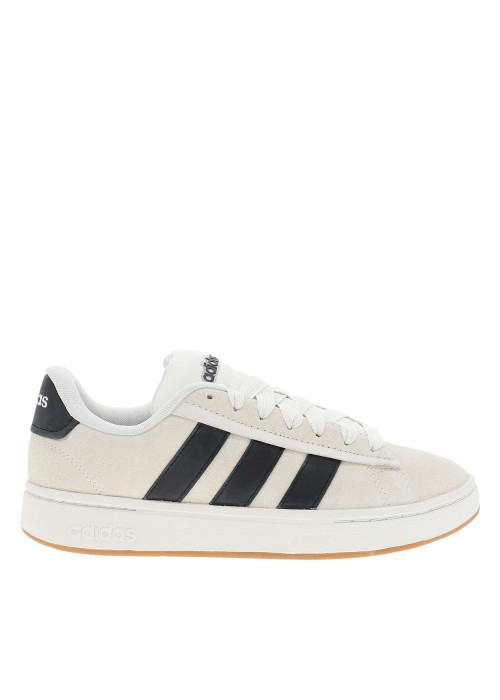 Baskets tennis blanches en cuir avec un talon plat et des lacets