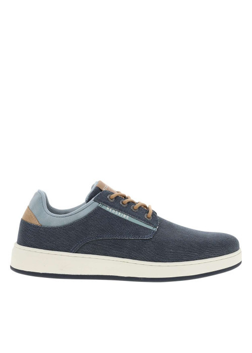 Basket basse bleu marine à talon plat avec un patch sur la languette