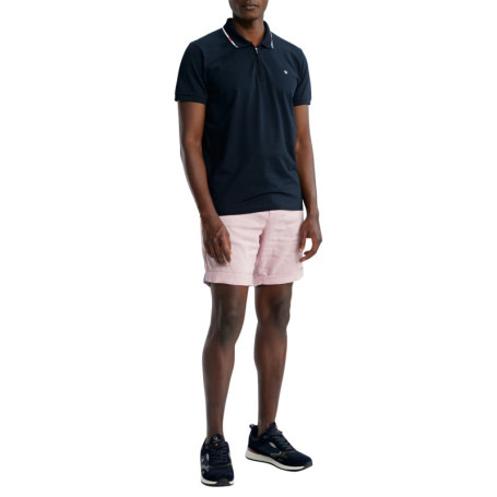 Polo en coton marine uni pourvu d'un col zippé...