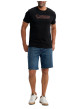Thumbnail T-shirt en coton noir uni pourvu de manches courtes et d'un col rond - Image 2