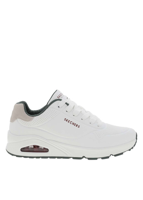 Baskets running blanches avec un talon compensé bas et des lacets