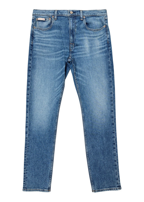 Jean en coton bleu avec une coupe slim muni d'un zip et d'un bouton