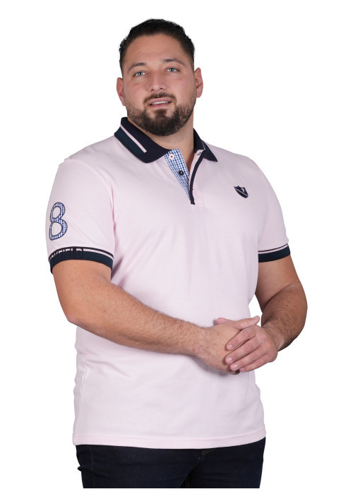 Polo en coton rose uni avec une coupe droite et un col à revers