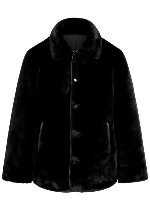 Blouson noir uni avec une coupe droite et des...