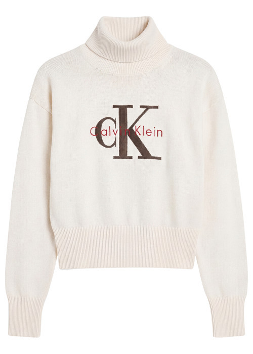 Pull en coton beige pourvu d'une coupe ajustée...