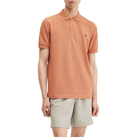 Polo en coton orange uni avec une coupe droite...