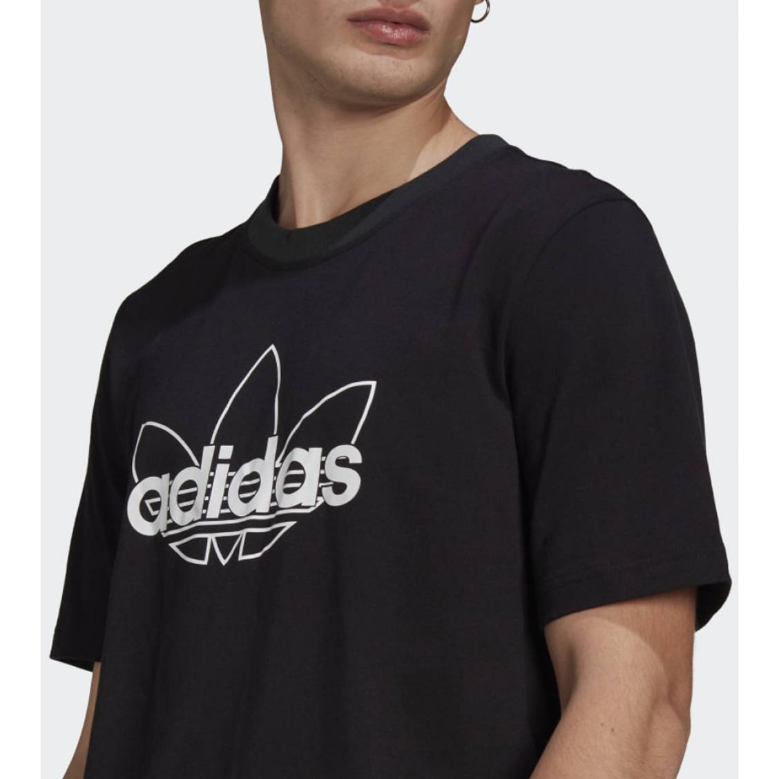 T-shirt adidas en coton blanc uni présentant une coupe droite et un large  logo noir débossé